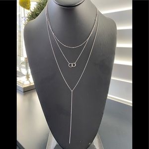 White Rhodium Plated Triple Strand Interlocking Ring Necklace
ADORNIA